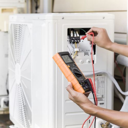 Pacoima AC Services Specialists technician servicing an HVAC system in Pacoima, CA
